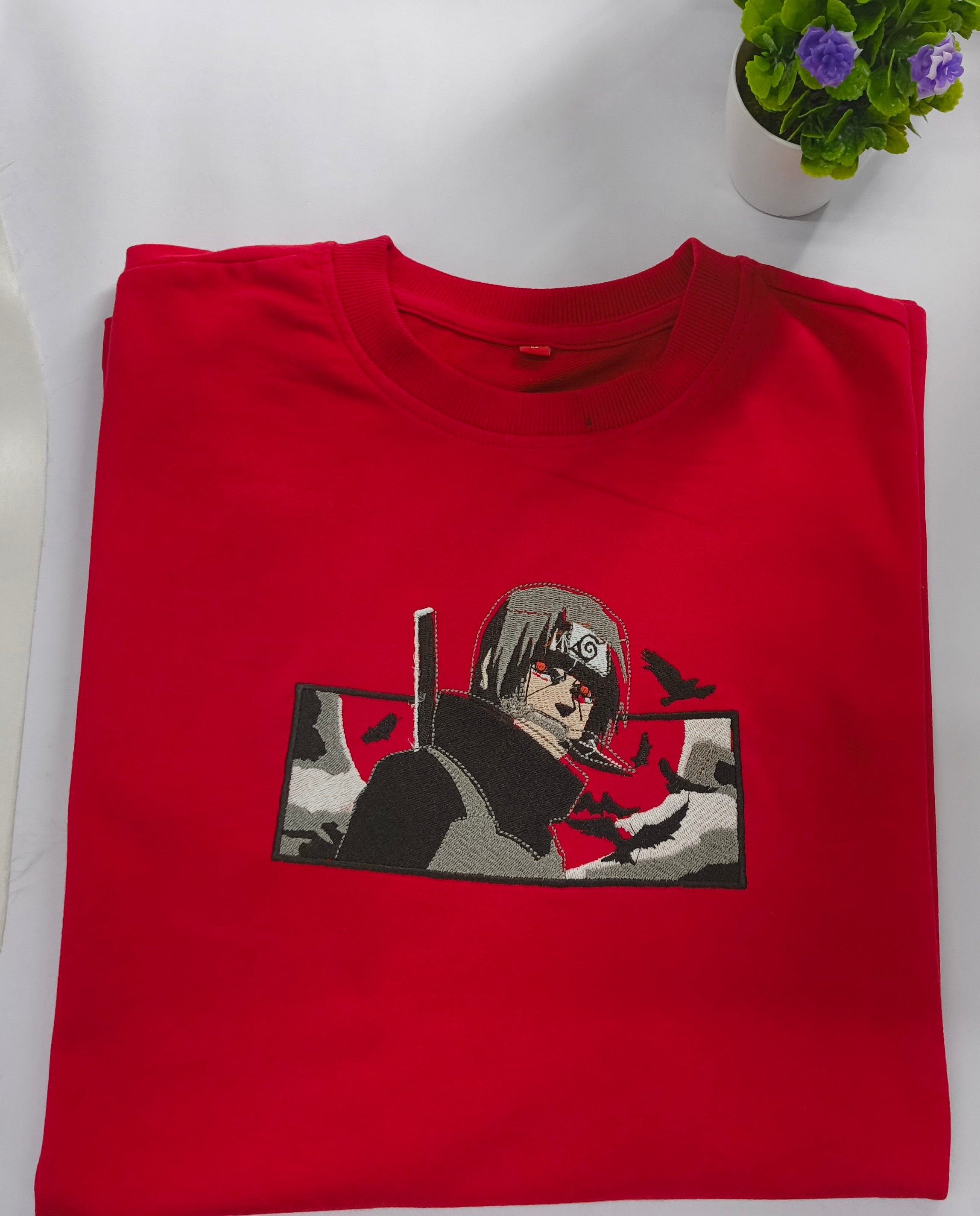 Channel the power of the Uchiha with iconic Itachi embroidery."